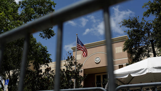 An American flag flies at ICE facilities as communities brace for a reported wave of ICE deportation raids in Miami 