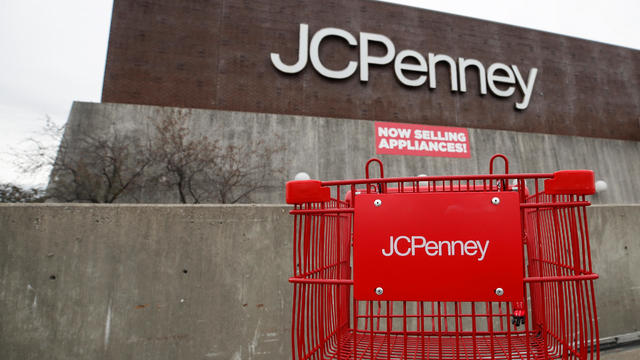 An empty shopping cart sits in front of the J.C. Penney department store in North Riverside 