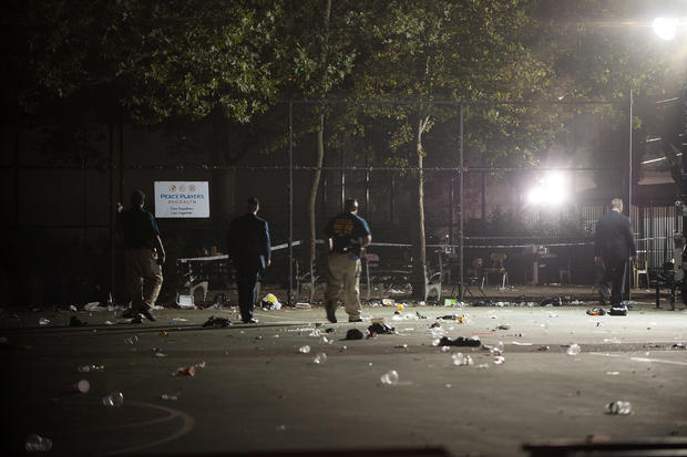 Members of the NYPD investigate a shooting at the Brownsville Recreational Center in New York City 