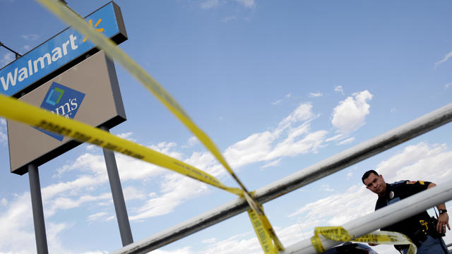 FILE PHOTO: A police officer stands next to a police cordon after a mass shooting at a Walmart in El Paso 