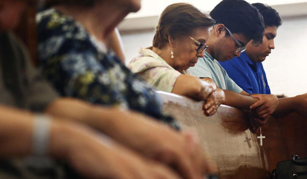 El Paso citizens praying in church 