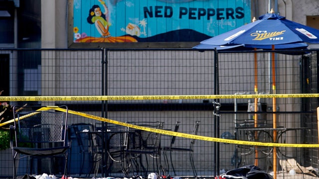 FILE PHOTO: Shoes are piled in the rear of Ned Peppers Bar at the scene after a mass shooting in Dayton 