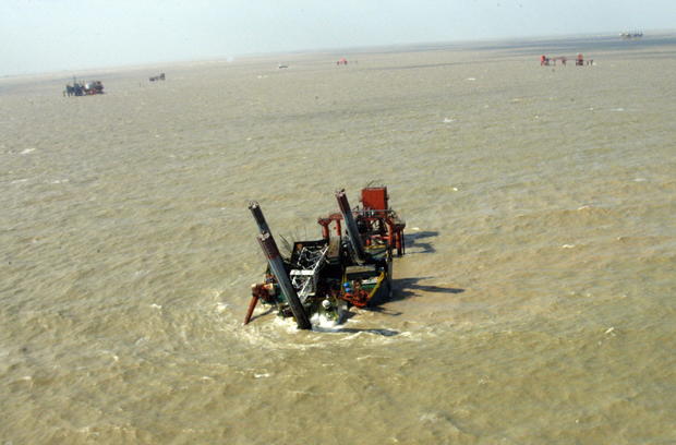 The damaged oil rig lies on the Shengli 