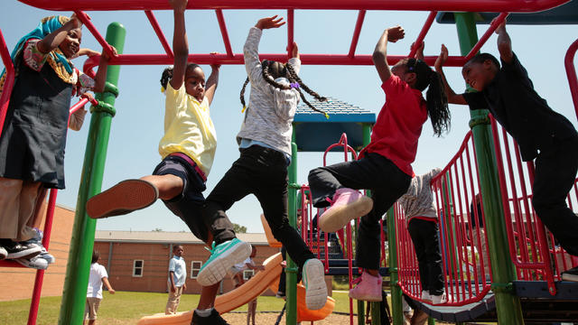 Children play during recess after returning back to B.K. Bruce Elementary School after the it was closed for two weeks in the aftermath of tropical storm Harvey in Houston 