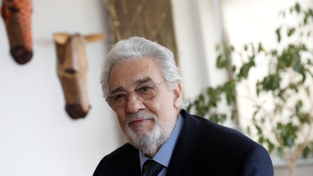 FILE PHOTO: Opera singer Placido Domingo sits during an event at the Manhattan School of Music in New York 