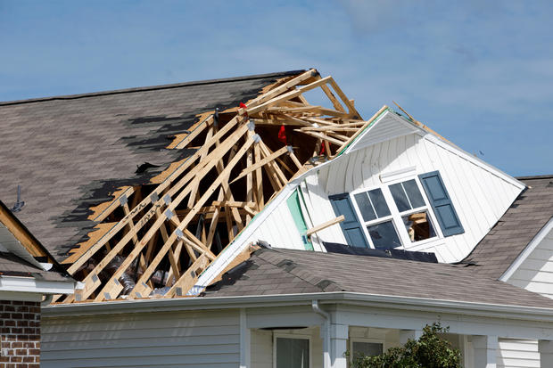 The roof of a home is ripped open by a tornado spawned by Hurricane Dorian in Carolina Shores, North Carolina 