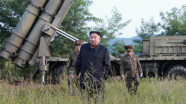 North Korean leader Kim Jong Un attends the testing of a super-large multiple rocket launcher in North Korea 