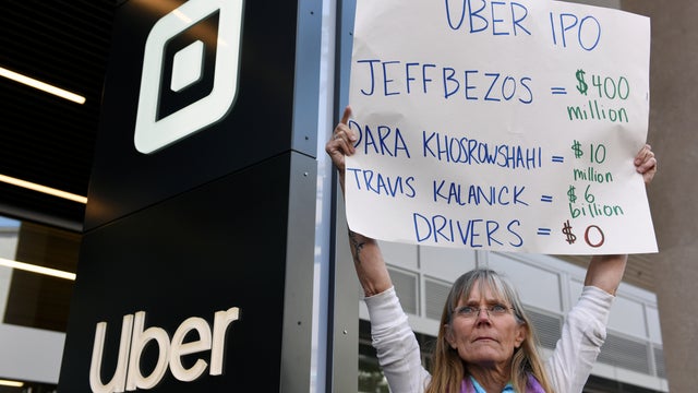 Uber drivers strike against the company's recent 25 percent wage cut outside Uber's head office in San Francisco 