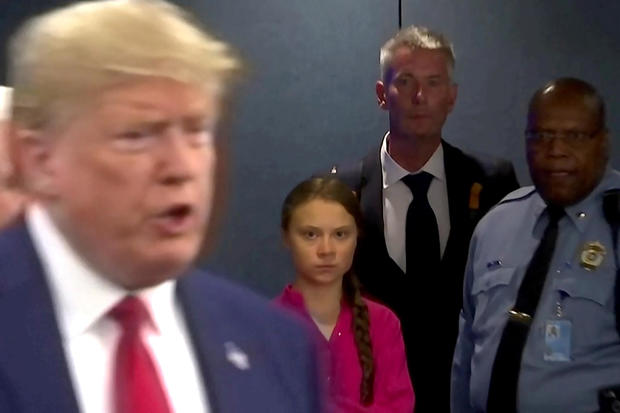 Swedish environmental activist Greta Thunberg watches as U.S. President Donald Trump enters the United Nations 
