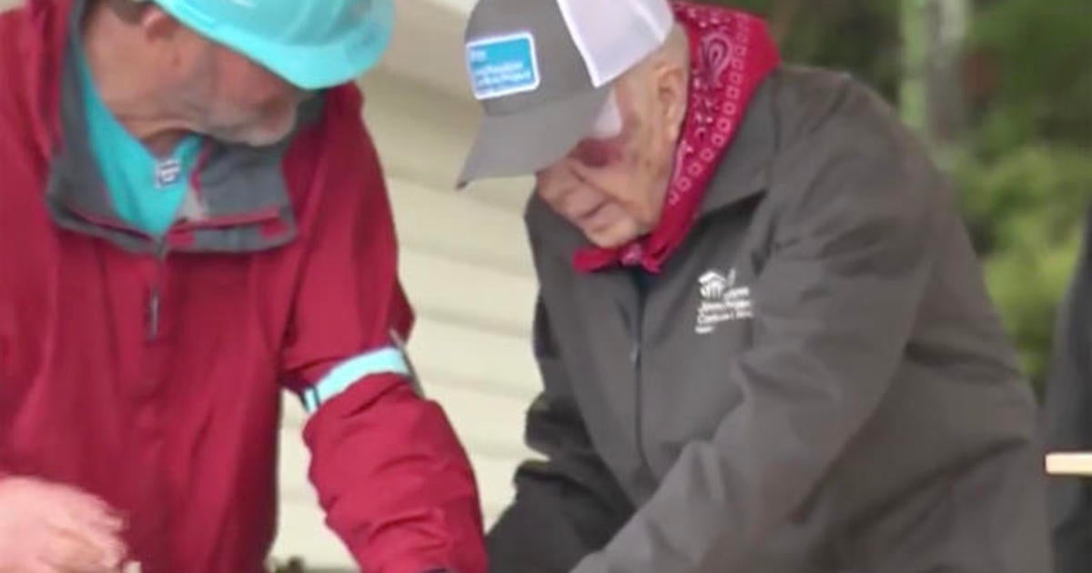 A day after falling, former President Jimmy Carter joins a Habitat for