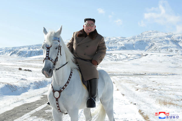North Korean leader Kim Jong Un rides a horse during snowfall in Mount Paektu 