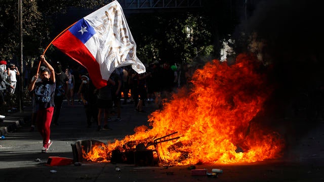 Protests Continue In Chile After President Piñera Declared State of Emergency And Suspended Subway Fare Hike 