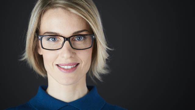 Woman headshot looking at camera. 