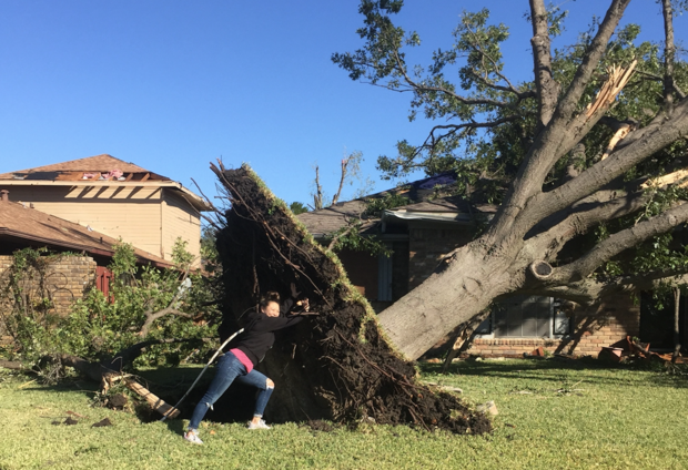 Jen Chambers in front of her tornado-damaged Richardson home 