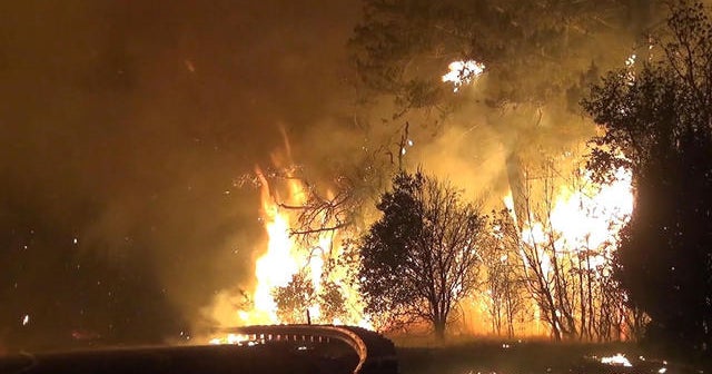 Out-of-control wildfires spread in northern and southern California