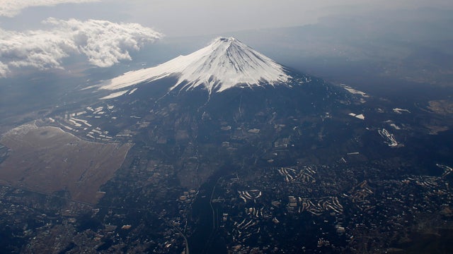 Japan's Mount Fuji is seen covered with snow from an airplane 