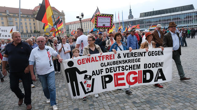 Pegida Gathering Coincides With Merkel Visit 