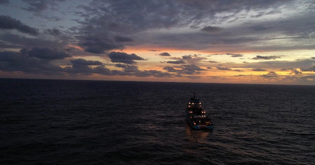 Watch "60 Minutes" fight 10-foot swells to board a 300-foot boat in the middle of the ocean