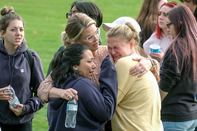 Students are comforted as they wait to be reunited with their parents following a shooting at Saugus High School November 14, 2019, in Santa Clarita, California.