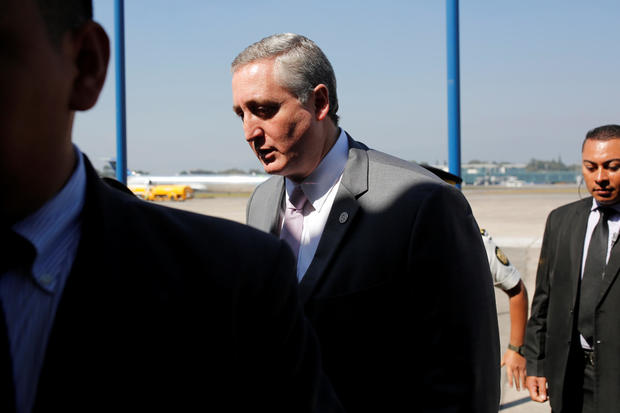 Guatemalan Interior Minister Enrique Degenhart is seen after the arrival of a flight of migrants deported from U.S., at La Aurora International airport in Guatemala 