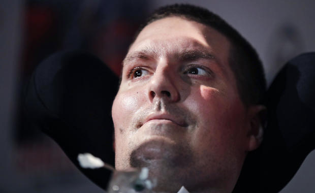 Pete Frates, who has amyotrophic lateral sclerosis, or ALS, and is the inspiration of the Ice Bucket Challenge, listens to a guest at Fenway Park in Boston on September 18, 2017. 