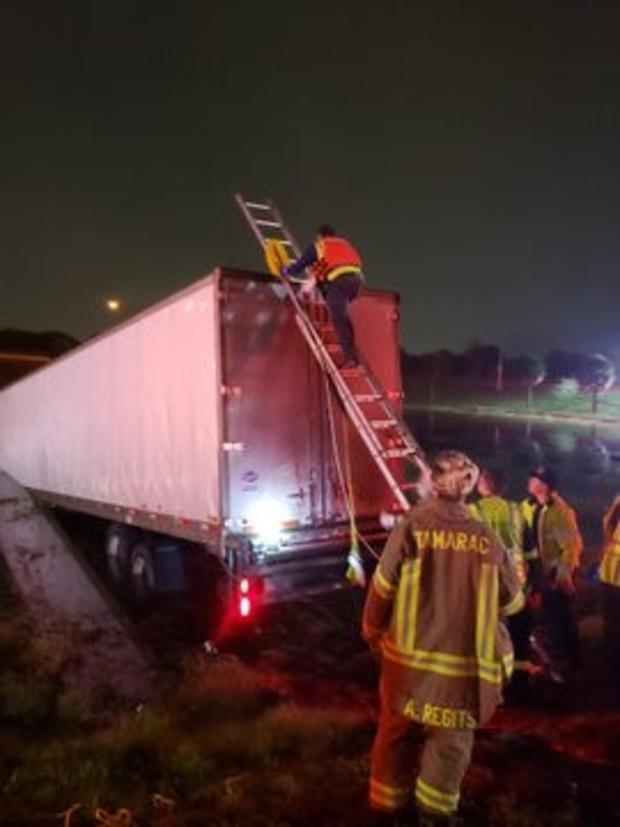 Tractor trailer ends up in retention pond off Florida Turnpike in Plantation 