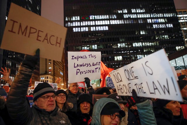 Protesters take part in a rally to support the impeachment and removal of President Trump in Chicago 