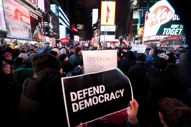 Demonstrators gather to demand the impeachment and removal of U.S. President Donald Trump during a rally at Times Square in New York City 