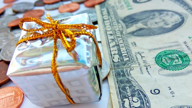 Present box with American coins with dollar usa background 