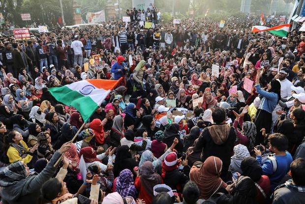 Demonstrators attend a protest against a new citizenship law, outside the Jamia Millia Islamia University in New Delhi 
