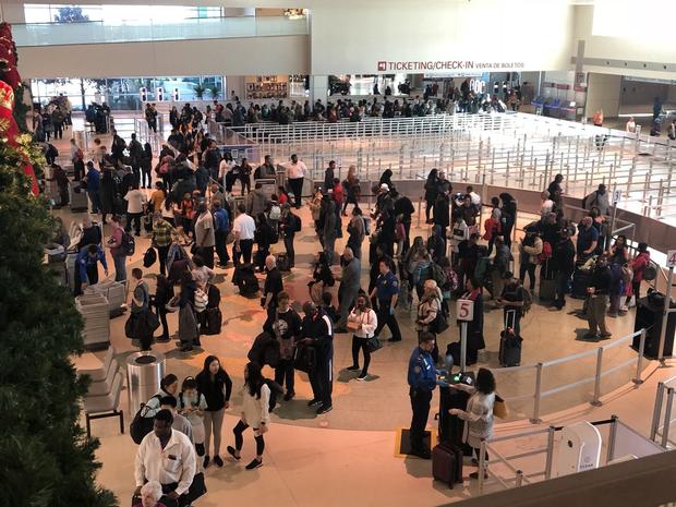 Travelers at Dallas Love Field on Christmas Eve 