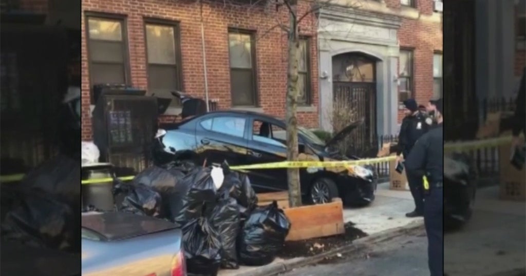 Car Crashes Into Apartment Building In Crown Heights - CBS New York