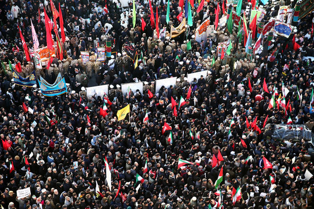 Iranian people attend a funeral procession for Iranian Major-General Qassem Soleimani, head of the elite Quds Force, and Iraqi militia commander Abu Mahdi al-Muhandis, who were killed in an air strike at Baghdad airport, in Tehran 