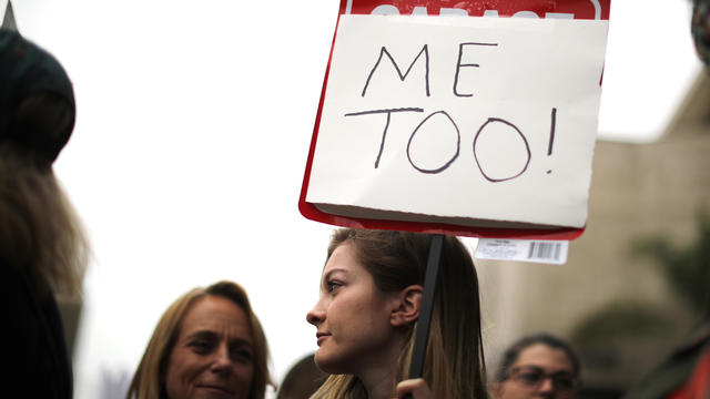 People participate in a protest march for survivors of sexual assault and their supporters in Hollywood 
