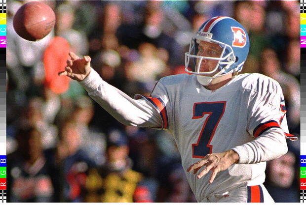Denver Broncos quarterback John Elway passes the b 