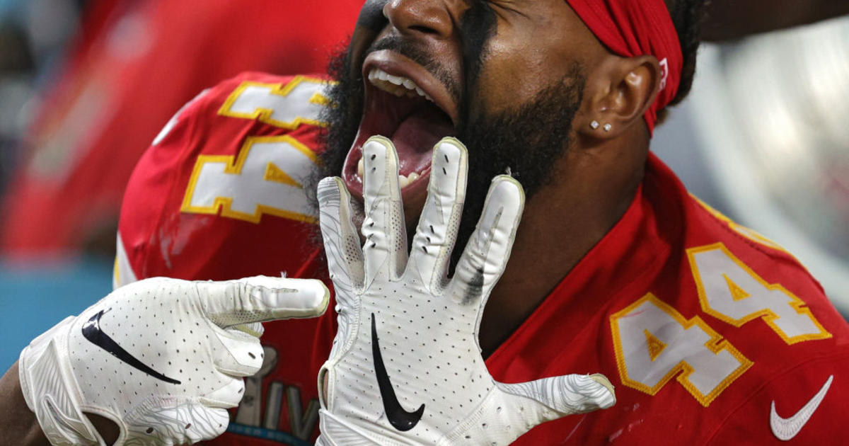 Kansas City Chiefs' Demone Harris (52) plays with the confetti, at