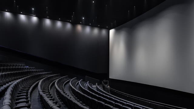 Black cinema white wide screen and auditorium seats 