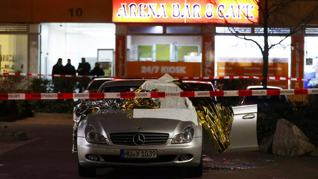 A damaged car is seen after a shooting in Hanau near Frankfurt 