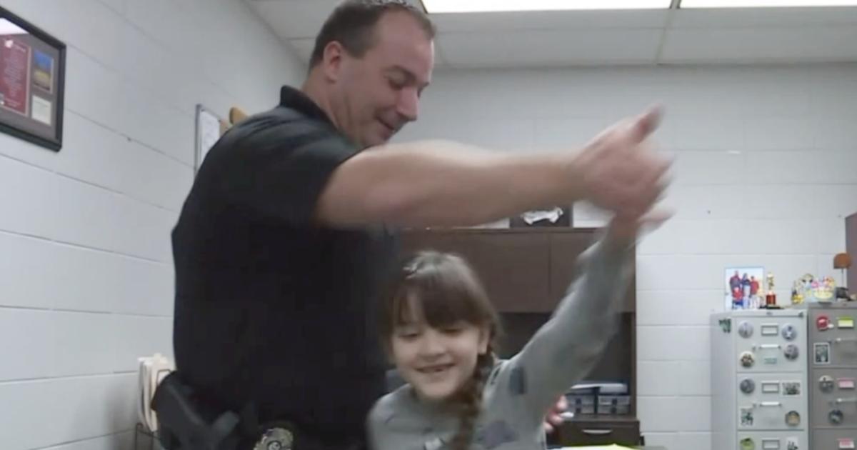 Officer Escorts 8 Year Old Girl To Father Daughter Dance After Her Dad