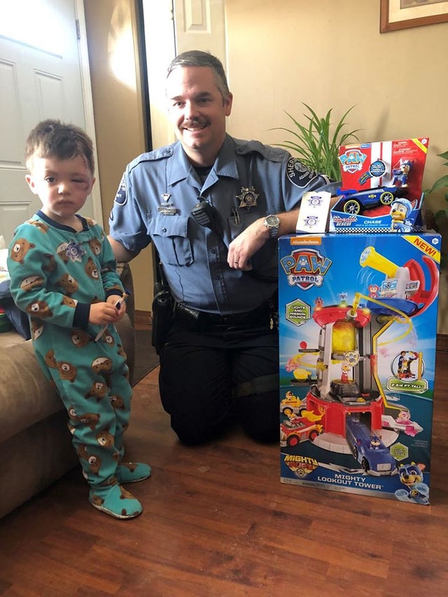 Boy with dog bite and ADCo deputy 