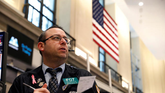 Traders work on the trading floor of the Amex Futures market at the New York Stock Exchange (NYSE) in New York 