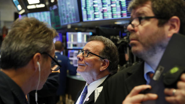 Traders work on the floor of the New York Stock Exchange after the opening bell of the trading session in New York March 13, 2020. 