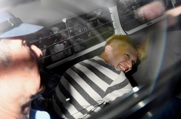 FILE PHOTO : Satoshi Uematsu, suspected of a deadly attack at a facility for the disabled, is seen inside a police car as he is taken to prosecutors, at Tsukui police station in Sagamihara, Japan 