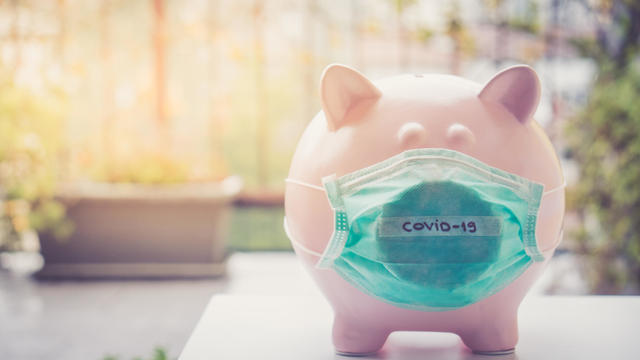 Piggy bank with Face Mask, Financial crisis and market crash due to coronavirus 