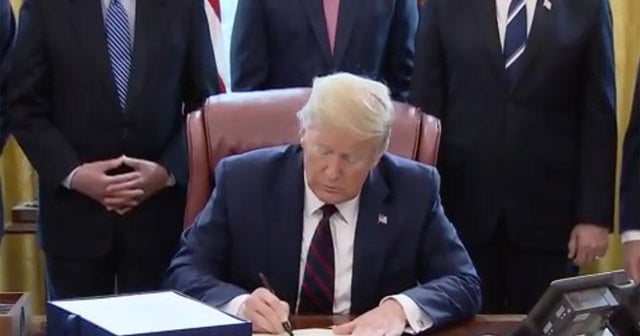 Trump signs $2 trillion coronavirus emergency relief bill - CBS News