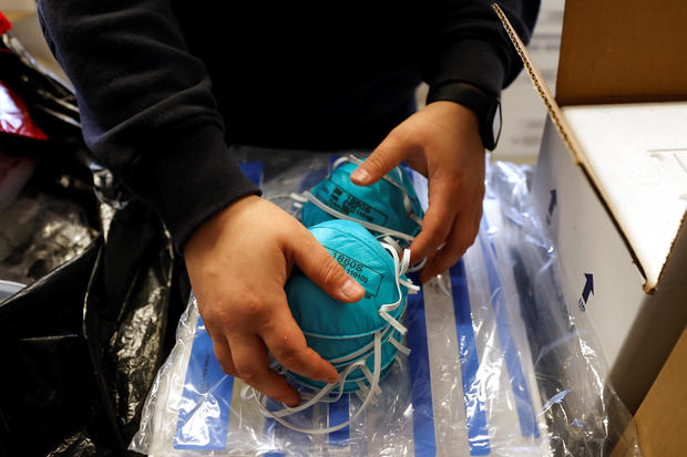 Emergency Medical Technician Emma Vargas prepares N95 protective masks for use by medical field personnel at a New York State emergency operations center in New Rochelle 