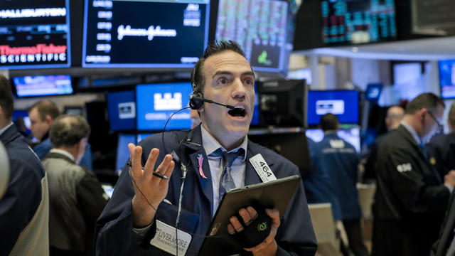 Traders work on the floor of the NYSE in New York 