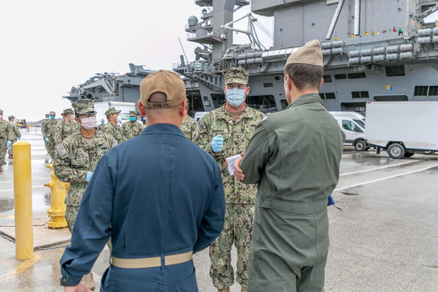 Sailors Transfer off USS Theodore Roosevelt Ashore for Quarantine 