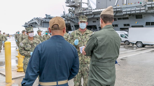 Sailors Transfer off USS Theodore Roosevelt Ashore for Quarantine 