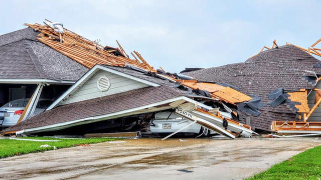 Damaged buildings and vehicles are seen in the aftermath of a tornado in Monroe, Louisiana, April 12, 2020, in this still image obtained from social media. 